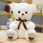 Ours en peluche avec nœud, amitié réconfortante