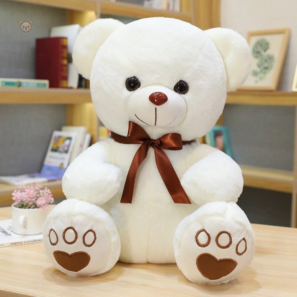 Ours en peluche avec nœud, amitié réconfortante