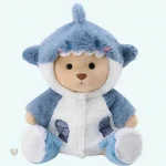 Ours en peluche déguisé en requin