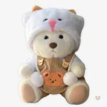 Doudou ourson en salopette marron doux