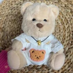 Ours en peluche en combinaison blanche pour enfants