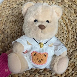 Ours en peluche en combinaison blanche pour enfants