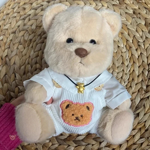 Ours en peluche en combinaison blanche pour enfants