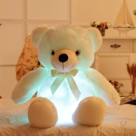 Ours en peluche éclatant, compagnon de nuit idéal