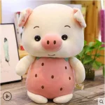 Peluche cochon en costume de fraise