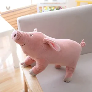Peluche cochon rose mignon et content