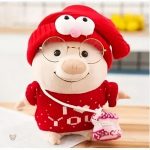 Cochon en peluche rose au pull doux, parfait pour un cadeau romantique