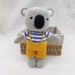 Peluche koala en saloppette