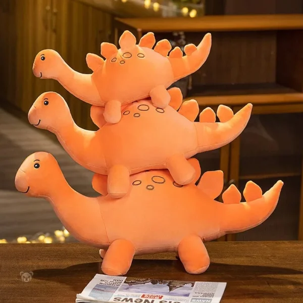 Peluche dinosaure orange avec pointes sur le dos