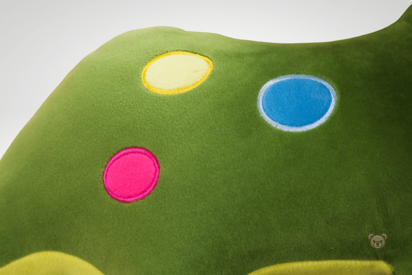 Dino en peluche, design vibrant et attrayant
