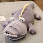 Doudou dinosaure magique en peluche pour câlins tendres