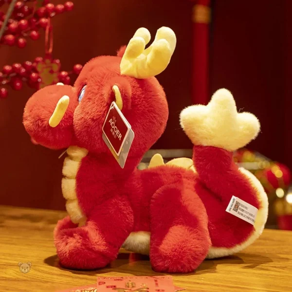 Peluche dragon rouge à cornes, douceur et originalité