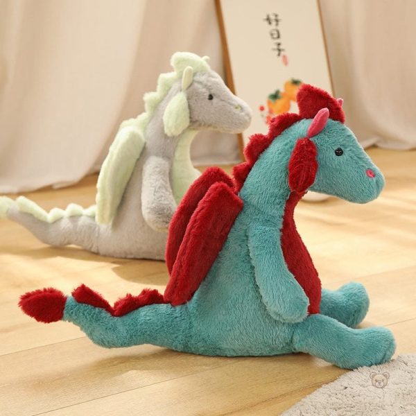 Peluche dragon en position assise
