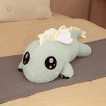 Peluche dragon aux yeux ronds, idéale pour les câlins