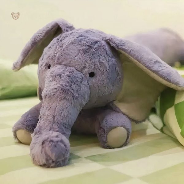 Géant éléphant peluche, parfait pour un décor enfantin