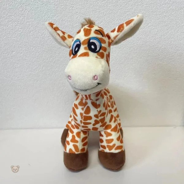 Jolie girafe en peluche avec grands yeux expressifs
