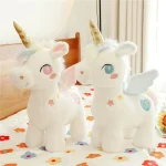 Peluche licorne blanche étoilée avec ailes dorées