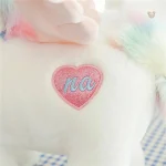 Peluche licorne aux ailes dorées