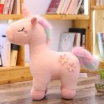 Peluche licorne blanche avec crinière arc-en-ciel