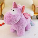 Peluche licorne aux couleurs vives et ailes scintillantes