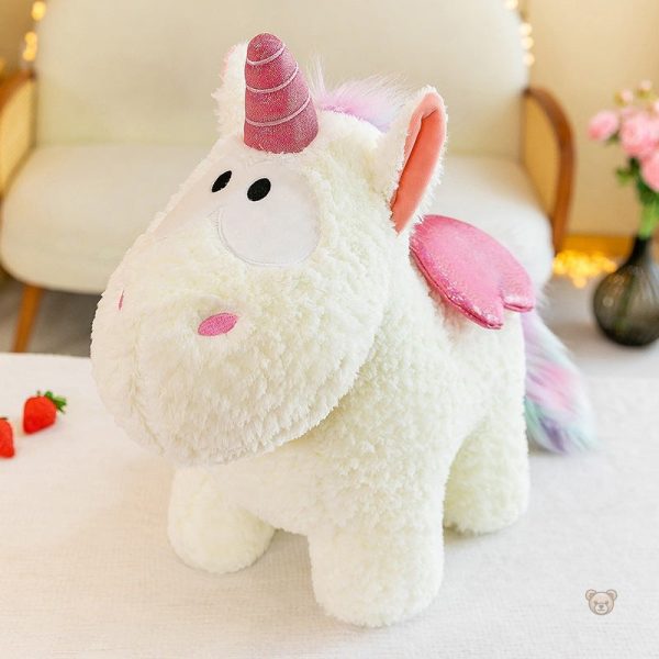 Licorne en peluche avec motifs colorés et paillettes