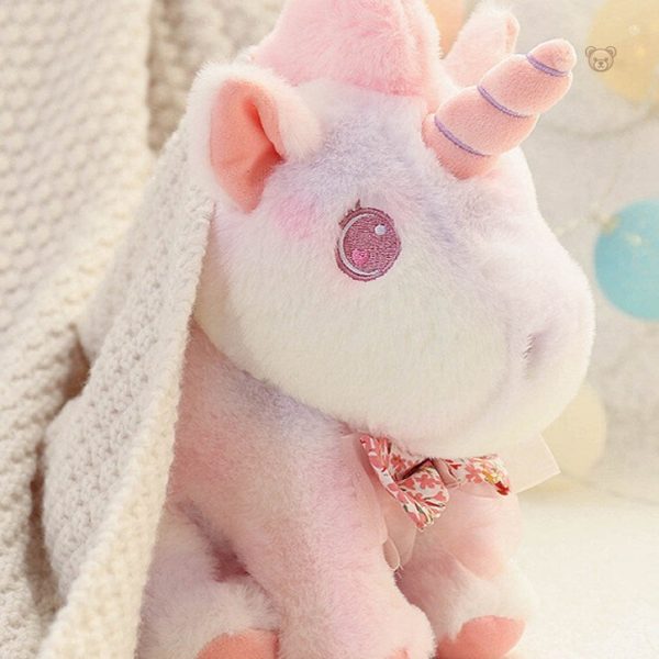 Peluche douce représentant une licorne colorée