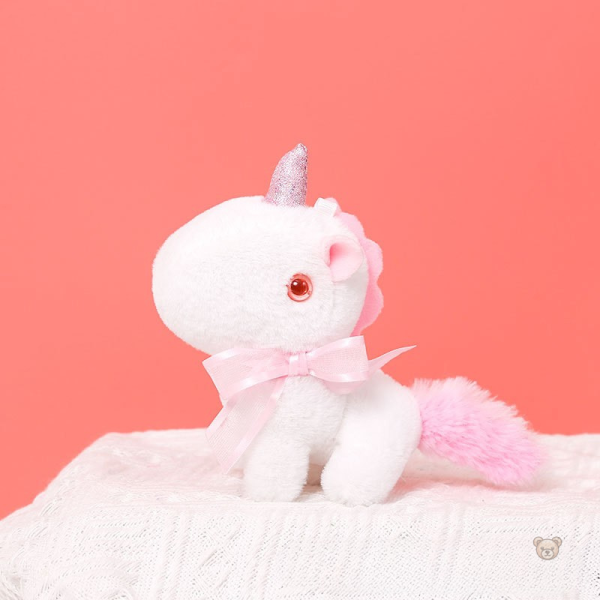 Mini peluche licorne avec détails scintillants et nœud
