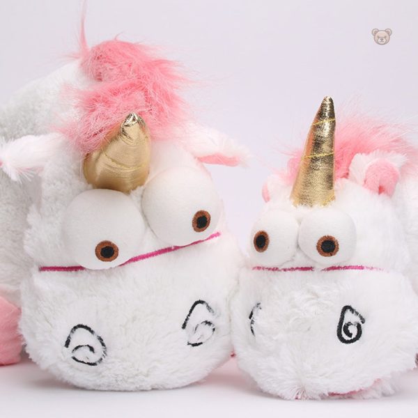 Jolie peluche licorne avec des détails dorés