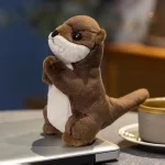 Peluche loutre aux mains jointes, douce et câline