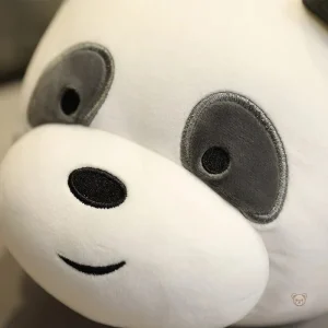Panda en peluche avec un large sourire, parfait pour les câlins