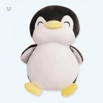 Peluche pingouin noir doux avec un sourire chaleureux