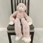 Peluche en forme de singe, compagnon de jeu