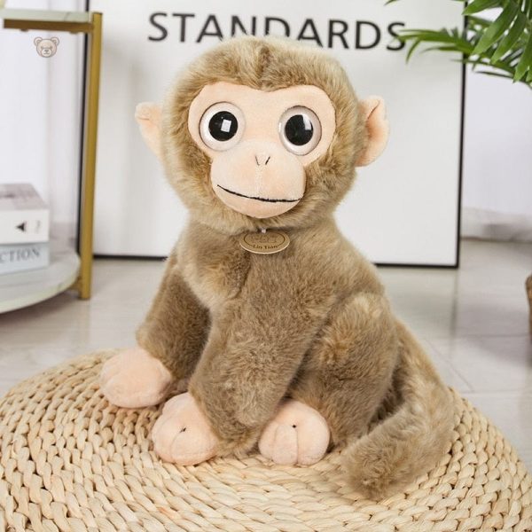 Singe en peluche avec expressions variées et charmantes