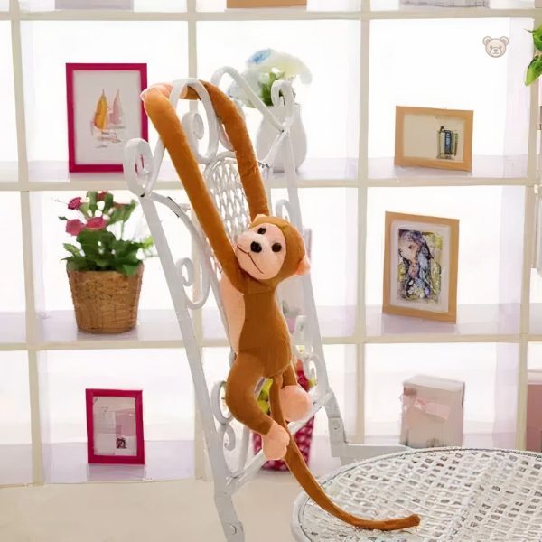 Peluche kawaii singe avec une longue queue, idéale pour jouer