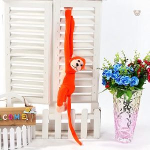 Singe orange en peluche, parfait pour les câlins