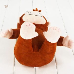 Singe souriant en peluche, accessoire ludique pour la chambre
