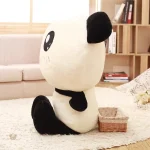 Panda souriant en peluche douce et câline
