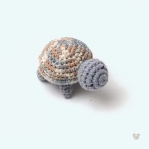 Peluche tortue crochet pour un confort douillet