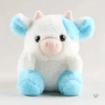 Peluche vache douce bleu et blanche, mignonne et câline