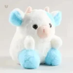 Vache en peluche bleue et blanche, parfaite pour les câlins