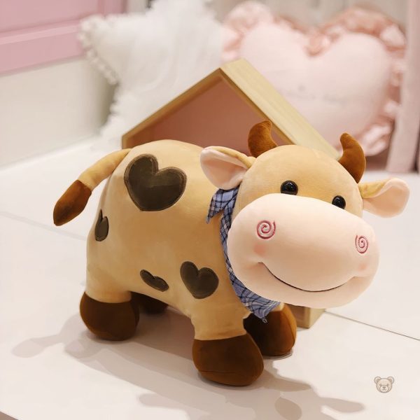 Vache en peluche tendre, idéale pour les câlins d'amour