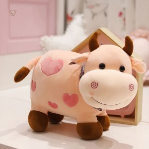 Peluche enfant vache au design affectueux et doux
