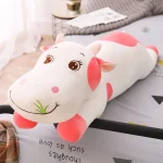 Vache en peluche avec des couleurs vives, heureuse