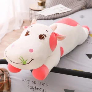 Vache en peluche avec des couleurs vives, heureuse
