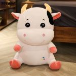 Peluche enfant en forme de vache, idéale pour les câlins