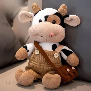 Peluche vache en salopette pour câlins et jeux d'imagination