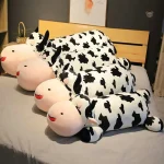 Peluche géante vache noire et blanche