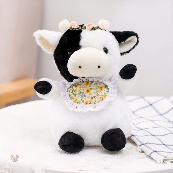 Vache en peluche élégante, idéale pour les câlins d'enfants