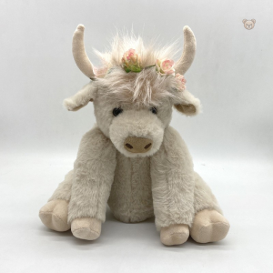Peluche vache Highland blanche avec couronne de fleurs