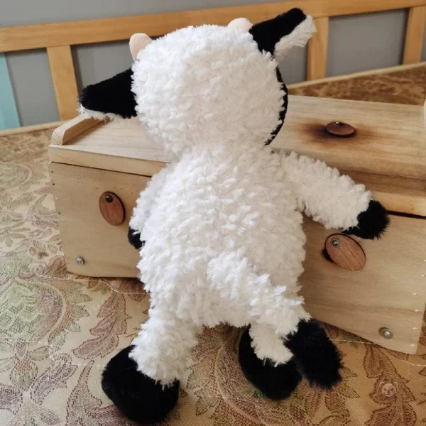 Peluche vache adorable avec fourrure blanche